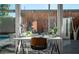 Bright home office space with modern desk, chair, and large glass doors to outdoor patio at 1621 E Maryland Ave, Phoenix, AZ 85016