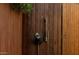 Outdoor shower showcasing wood door and decorative shower head and handle at 1621 E Maryland Ave, Phoenix, AZ 85016