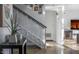Modern staircase with sleek railing, leads to upper level, with artwork at 1621 E Maryland Ave, Phoenix, AZ 85016