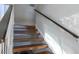 Stairway with wooden steps and handrail offers a transition between levels in this modern home at 1621 E Maryland Ave, Phoenix, AZ 85016