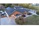 Aerial view of the estate featuring a solar array, large lawn, expansive patios and driveway at 16322 E Fairview St, Gilbert, AZ 85295