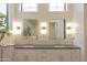 Elegant bathroom featuring double sinks, stylish fixtures, and modern lighting at 16322 E Fairview St, Gilbert, AZ 85295