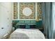 Stylish bedroom with vibrant wallpaper, a plush bed, and decorative elements creating a serene atmosphere at 16322 E Fairview St, Gilbert, AZ 85295