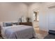 Inviting bedroom featuring a comfortable bed, dresser, and access to an en-suite bathroom for convenience and privacy at 16322 E Fairview St, Gilbert, AZ 85295