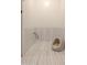 Functional dog room with dedicated faucet and hose attachment, and a comfy dog bed, perfect for pet care at 16322 E Fairview St, Gilbert, AZ 85295