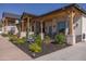 Landscaped yard with fountain, patio and unique design elements complement the stylish exterior of this beautiful home at 16322 E Fairview St, Gilbert, AZ 85295