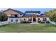Expansive home with well manicured lawn, stylish accents and a welcoming entrance for luxurious living at 16322 E Fairview St, Gilbert, AZ 85295