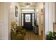 Elegant foyer with hardwood floors, paneled walls, and stylish lighting setting a sophisticated tone at 16322 E Fairview St, Gilbert, AZ 85295
