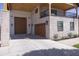 View of garages with brick accents, with room for multiple vehicles and storage at 16322 E Fairview St, Gilbert, AZ 85295