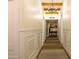 Long hallway with decorative rugs and crown molding at 16322 E Fairview St, Gilbert, AZ 85295