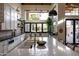 Bright kitchen with an island, modern appliances, and views of the backyard and outdoor living spaces at 16322 E Fairview St, Gilbert, AZ 85295