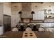 Well-appointed kitchen featuring a stylish island, modern appliances, and ample cabinet space at 16322 E Fairview St, Gilbert, AZ 85295