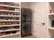 Convenient laundry area with modern stackable washer and dryer and built-in shelving for storage and organization at 16322 E Fairview St, Gilbert, AZ 85295