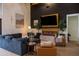 Bright living room with a modern fireplace, stylish decor, and an inviting seating area at 16322 E Fairview St, Gilbert, AZ 85295