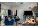 Inviting living room with comfortable seating, a TV, and a dining area, creating a versatile space for relaxation and entertainment at 16322 E Fairview St, Gilbert, AZ 85295