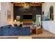 Inviting living room featuring a cozy fireplace, elegant decor, and comfortable seating arrangements at 16322 E Fairview St, Gilbert, AZ 85295