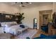 Comfortable main bedroom with a sitting area and accent wall at 16322 E Fairview St, Gilbert, AZ 85295