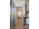 View of the pantry, stainless steel refrigerator and lots of storage at 16322 E Fairview St, Gilbert, AZ 85295