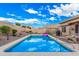 Private backyard with a refreshing pool and a well-maintained landscape at 16424 W Cottonwood St, Surprise, AZ 85388