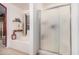 Bathroom showcasing a bathtub, shower, and decorative accents at 16424 W Cottonwood St, Surprise, AZ 85388