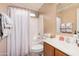 Cozy bathroom with a shower-tub combo, toilet, and a vanity at 16424 W Cottonwood St, Surprise, AZ 85388