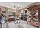 Bright dining area featuring a stylish china cabinet, access to the backyard patio, and neutral decor at 16424 W Cottonwood St, Surprise, AZ 85388