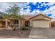 Charming single-story home with a well-maintained desert landscaped front yard and two car garage at 16424 W Cottonwood St, Surprise, AZ 85388