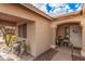 A welcoming front porch, featuring cozy seating, decorative accents, and a well-maintained entrance at 16424 W Cottonwood St, Surprise, AZ 85388