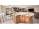 Spacious kitchen with a breakfast bar extending into the living space at 16424 W Cottonwood St, Surprise, AZ 85388