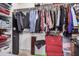 Organized walk-in closet with shelves and hanging rods for ample storage at 16424 W Cottonwood St, Surprise, AZ 85388