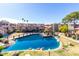 Beautiful aerial view of the condo's pond, bridge and surrounding landscaping at 1645 W Baseline W Rd # 2032, Mesa, AZ 85202