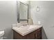 Bathroom featuring a vanity with gray-toned wall and a decorative mirror at 1645 W Baseline W Rd # 2032, Mesa, AZ 85202