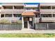 Inviting multi-story condo with a red tile entrance and well-kept landscaping at 1645 W Baseline W Rd # 2032, Mesa, AZ 85202