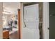 Image of laundry area with stacked washer and dryer, and light living area visible in background at 1645 W Baseline W Rd # 2032, Mesa, AZ 85202