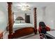 Cozy main bedroom featuring a four-poster bed, ceiling fan and two closets at 1645 W Baseline W Rd # 2032, Mesa, AZ 85202