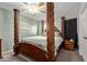Spacious main bedroom featuring a four-poster bed and ceiling fan at 1645 W Baseline W Rd # 2032, Mesa, AZ 85202