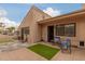 Private backyard with shaded seating and artificial turf provides a relaxing outdoor oasis at 1658 N Sierra Vista Dr, Tempe, AZ 85288