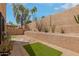 Desert landscaped backyard with artificial turf offers a low maintenance outdoor space at 1658 N Sierra Vista Dr, Tempe, AZ 85288