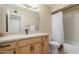 Well-lit bathroom features a tub, shower and an updated vanity with ample storage space at 1658 N Sierra Vista Dr, Tempe, AZ 85288