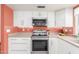 Functional kitchen space with stainless steel appliances and updated fixtures at 1658 N Sierra Vista Dr, Tempe, AZ 85288