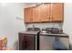 Laundry room with modern Samsung washer and dryer units for convenience and efficiency at 1658 N Sierra Vista Dr, Tempe, AZ 85288