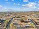 Expansive aerial view of the property and surrounding desert landscape with clear blue skies at 16643 W Quail Run Rd, Surprise, AZ 85378
