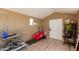 Functional space with dog grooming equipment and treadmill, set against neutral walls and wood-look flooring at 16643 W Quail Run Rd, Surprise, AZ 85378