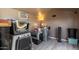 Interior view of gray kennels, complemented by gray wood-look flooring, offering secure animal accommodations at 16643 W Quail Run Rd, Surprise, AZ 85378