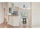 Open kitchen features light cabinetry and an island with eat-in seating at 16643 W Quail Run Rd, Surprise, AZ 85378