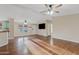 Bright living room with hardwood floors, ceiling fans, and ample natural light at 16643 W Quail Run Rd, Surprise, AZ 85378
