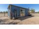 The exterior view of the outbuilding reveals ample storage for tools at 16643 W Quail Run Rd, Surprise, AZ 85378