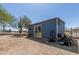 Exterior view of an outbuilding, with a sliding glass door at 16643 W Quail Run Rd, Surprise, AZ 85378