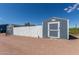This outbuilding has a secure fenced-in area, offering secure storage or hobby space at 16643 W Quail Run Rd, Surprise, AZ 85378