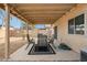 Outdoor patio with outdoor dining and hardscaped landscaping at 16729 N 157Th Ave, Surprise, AZ 85374